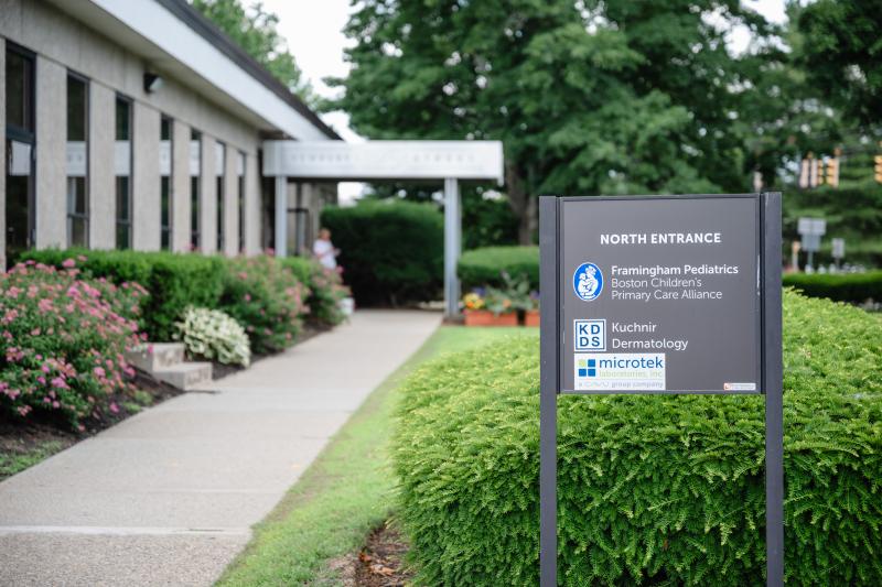 a sign in front of a building